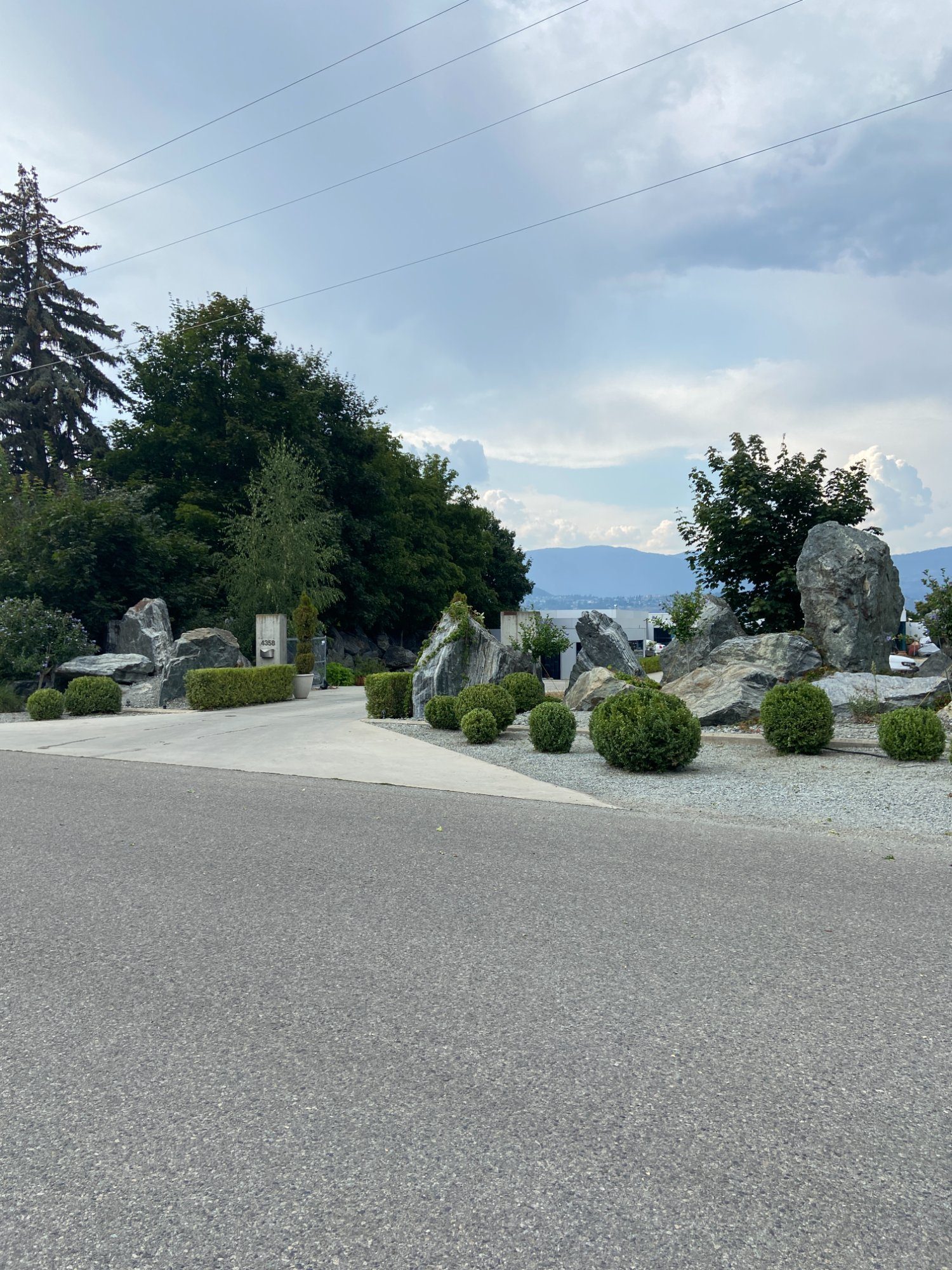 Boxwood and rock landscape maintenance Kelowna